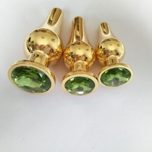 Анальная пробка "Ювелир" танго, золотая, светло- зеленый кристалл размер L